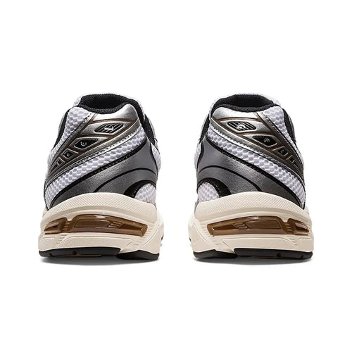 ASICS GEL-1130 White Clay Canyon straight rear view of both shoes showing the black and silver heel counter construction, brown Clay Canyon accent stripes, white mesh upper, and bronze GEL windows in the pre-aged sail midsole