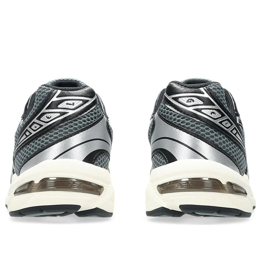 ASICS Gel-1130 Steel Grey Black heel view showing silver overlays and cream GEL cushioning  