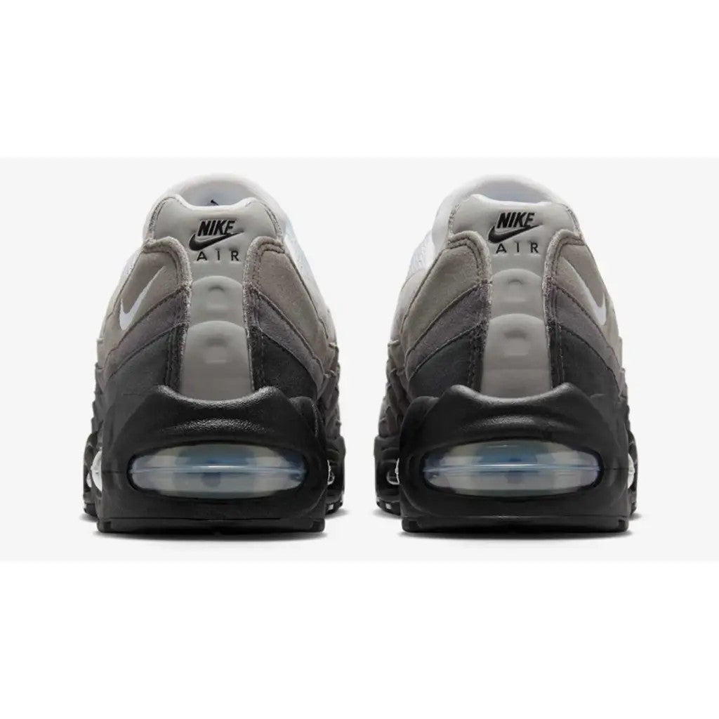 Nike Air Max 95 OG Blue Tint pair rear view showing Nike Air heel branding and blue tint Big Bubble unit