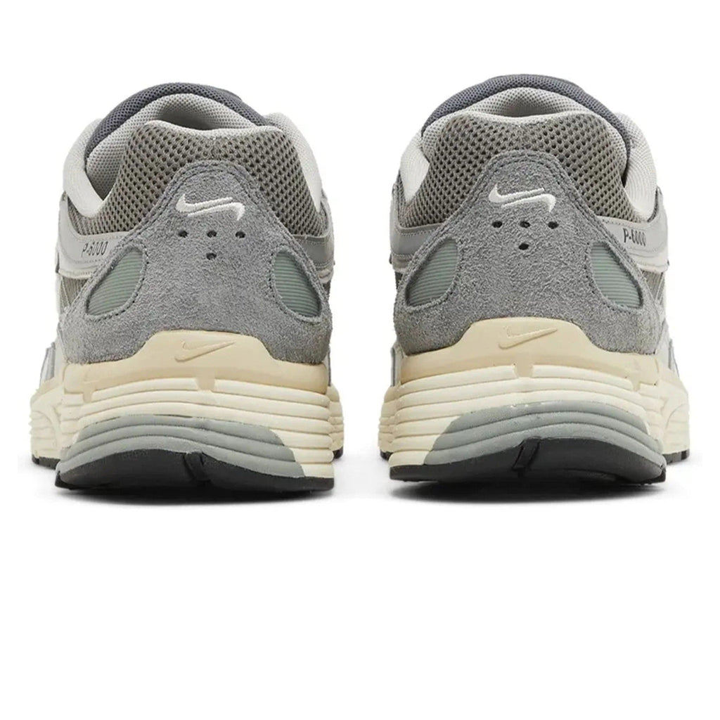 Nike P-6000 Flat Pewter rear view of pair on white background showing grey suede heel counter, white embroidered Swoosh, cream midsole, and P-6000 branding