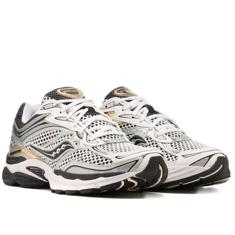 Front view of the Saucony ProGrid Omni 9 S70739-9 sneaker, showing the white and black athletic mesh toe box and bold metallic silver and gold overlays.