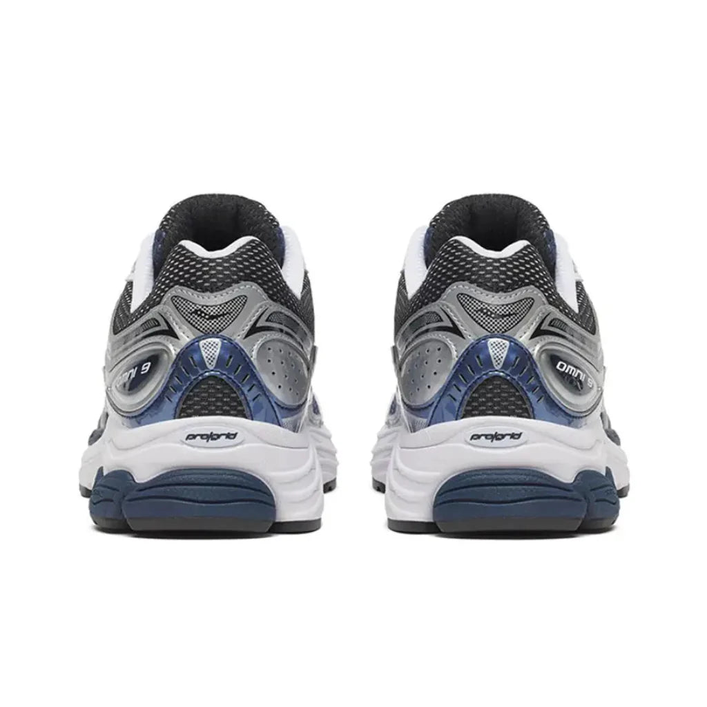 Back heel view of the Saucony ProGrid Omni 9 Deep Navy running shoe, displaying the supportive heel structure, rich navy tones, and durable rubber outsole.