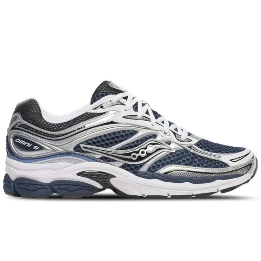 Side profile of the Saucony ProGrid Omni 9 S70739-41 in Deep Navy, showing the early 2000s technical lines, classic Saucony logo, and chunky retro midsole.